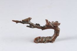 A JAPANESE BRONZE BIRD ON A BRANCH. 3ins.