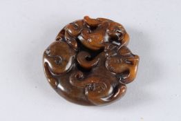 A CHINESE CARVED JADE ROUNDEL.
