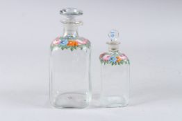 TWO PAINTED PERSIAN GLASS BOTTLES AND STOPPERS.
