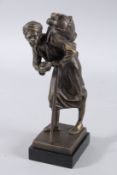 A BRONZE ARAB with a pack on his back and a walking stick. 9.5ins high.