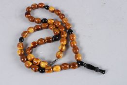 AN AMBER NECKLACE.