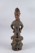 A GOOD CARVED TRIBAL GROUP, woman and baby. 2ft 2ns high