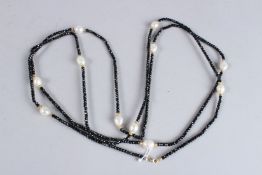 AN ONYX BEAD AND PEARL NECKLACE. 150cms long.