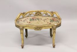A 19TH CENTURY FRENCH KIDNEY SHAPED STOOL with tapestry seat.