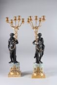 A GOOD PAIR OF THOMAS HOPE DESIGN FOUR-LIGHT CANDELABRA with a classical mask and female figure,
