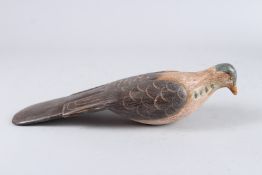 A CARVED WOOD PIGEON 12ins long.