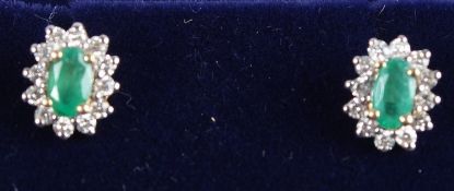 A PAIR OF 18CT YELLOW GOLD, EMERALD AND DIAMOND EAR STUDS.