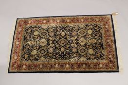 A GOOD PERSIAN PART SILK RUG with multi-coloured motifs within a red floral border. 5ft 2ins x 3ft.