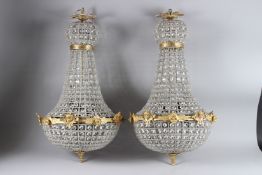 A GOOD PAIR OF BEADWORK CHANDELIERS. 27ins long.