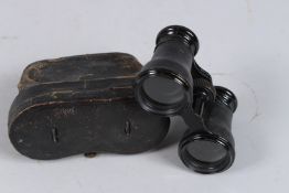 A PAIR OF PILLISCHER OPERA GLASSES in a leather case.