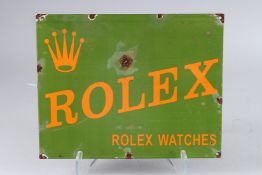 AN ENAMEL ROLEX SIGN. 11.5ins x 14.5ins.