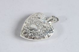 A SILVER EMBOSSED HEART PERFUME BOTTLE.