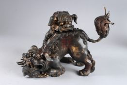 A LARGE BRONZE FOO DOG TWO-SECTION CENSER. 9ins high.