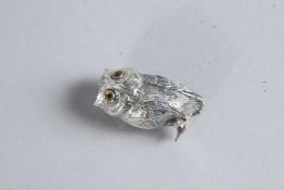A SILVER OWL PIN CUSHION.