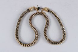 A SILVER DIAMANTE NECKLACE with coloured stones.