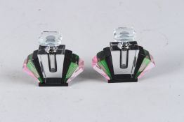 A SMALL PAIR OF BLACK ART DECO DESIGN SCENT BOTTLES AND STOPPERS. 3.25ins high.
