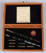 A CHRONICLE BOXED PEN SET.