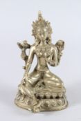 A CHINESE BRONZE FEMALE DEITY, seated on a lotus base. 22cms high.