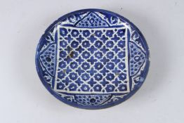 A BLUE ISLAMIC CIRCULAR PLATE. 11ins diameter