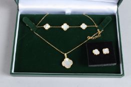 A THREE PIECE SILVER, GOLD PLATED AND MOTHER-OF-PEARL CLOVER SET.
