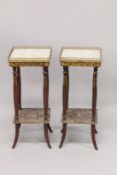 A PAIR OF FRENCH MARBLE TOP SQUARE TABLES with curving legs and under-tier. 2ft 4ins high x 1ft