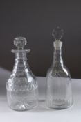 TWO GEORGIAN GLASS DECANTERS AND STOPPERS.