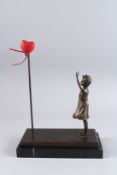 AFTER BANKSY. A BRONZE GIRL WITH HEART. Signed. 13ins high, on a marble base.