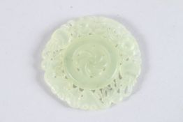 A PIERCED JADE ROUNDEL. 1.75ins diameter.