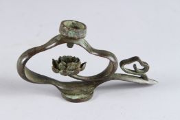A MINIATURE BRONZE CANDLESTICK. 2.5ins.