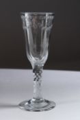 A GEORGIAN WINE GLASS with long tapering bowl and facet stem. 6.5ins high.