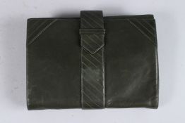 AN YVES ST LAURENT BLACK LEATHER CLUTCH BAG.