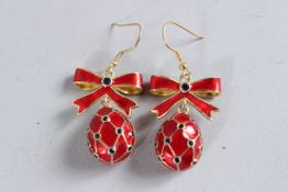 A PAIR OF RUSSIAN RED ENAMEL EGG EARRINGS.