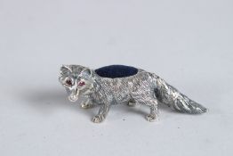 A SILVER FOX PIN CUSHION.