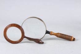 A CONNOISSEUR EYE GLASS AND MAGNIFYING GLASS (2).