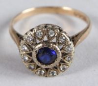 AN 18CT GOLD, SAPPHIRE AND DIAMOND CLUSTER RING.