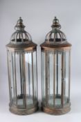 A LARGE PAIR OF COPPER CIRCULAR LANTERNS. 33ins high x 11ins diameter.