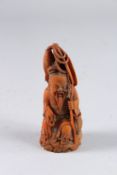 A CARVED SOAPSTONE CHINESE MAN. 6ins high.