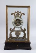A SKELETON CLOCK in a glass dome. 16ins high.