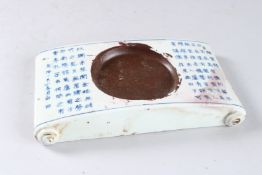 A CHINESE BLUE AND WHITE INKSTONE. 8ins high.