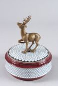 A SEVRES DESIGN CIRCULAR PORCELAIN BOX AND COVER with stag handle. 5ins diameter.