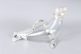 A NOVELTY GLASS AND SILVER PLATE WALRUS CLARET JUG. 13ins high.