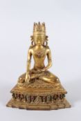 A GILT BRONZE SEATED GOD. 9.5ins high.