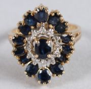 A 9CT GOLD, SAPPHIRE AND DIAMOND CLUSTER RING.