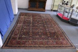 A VERY LARGE PERSIAN CARPET with allover floral motifs, in a triple row motif. 11ft 3ins x 7ft