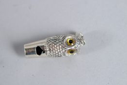 A SILVER OWL WHISTLE.