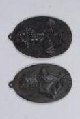 A PAIR OF OVAL CAST IRON PLAQUES, 