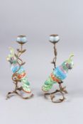 A GOOD PAIR OF PARROT PORCELAIN AND GILT METAL CANDLESTICKS. 13ins high.