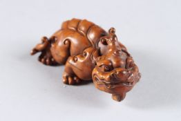 A CHINESE CARVED WOOD DRAGON. 3ins.
