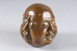 A FOUR FACED BRONZE BUDDHA. 4.5ins.