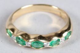 AN 18CT YELLOW GOLD, EMERALD AND DIAMOND RING.